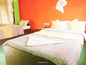 A bed or beds in a room at Hotel Butterfly - Peaceful Garden for Nature Lovers