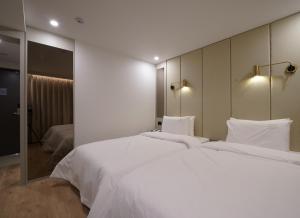 Voodi või voodid majutusasutuse Ocean city hotel toas