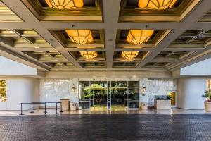 a large hall with lights on the ceilings at The Signature MGM by Orgoto in Las Vegas