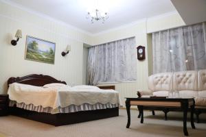 Postel nebo postele na pokoji v ubytování Hotel Botakoz
