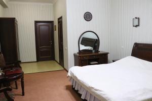 Postel nebo postele na pokoji v ubytování Hotel Botakoz