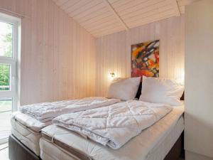 Postel nebo postele na pokoji v ubytování 5 person holiday home in GROEMITZ