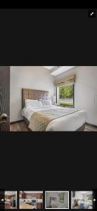 um quarto com uma cama grande e uma janela em Canmore Mountain Retreat. Hot Tub, Pool, King Bed! em Canmore