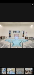 a large swimming pool in a large building at Canmore Mountain Retreat. Hot Tub, Pool, King Bed! in Canmore