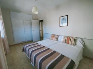 Postel nebo postele na pokoji v ubytování CASA PORTELA APARTAMENTOS