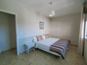 Postel nebo postele na pokoji v ubytování CASA PORTELA APARTAMENTOS