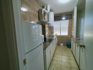 Kuchyň nebo kuchyňský kout v ubytování CASA PORTELA APARTAMENTOS