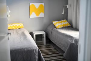 Säng eller sängar i ett rum på Lake Residence Ukkohalla
