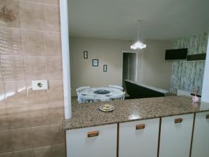 Kuchyň nebo kuchyňský kout v ubytování CASA PORTELA APARTAMENTOS