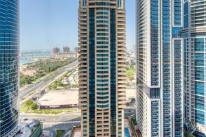 a view of a tall building in a city at Bright 1BR at Sulafa Tower Dubai Marina by Deluxe Holiday Homes in Dubai