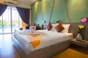 Postel nebo postele na pokoji v ubytování Aurora Resort Khao Yai + 37 fotografií