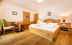 Posteľ alebo postele v izbe v ubytovaní Wellness & Sporthotel Alpenhof