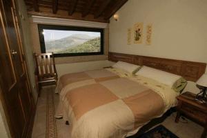 Posteľ alebo postele v izbe v ubytovaní Apartamento Rural El Labrador es un cómodo y acogedor apartamento