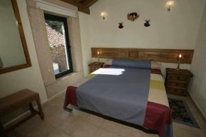 Posteľ alebo postele v izbe v ubytovaní Apartamento Rural El Labrador es un cómodo y acogedor apartamento