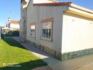 a side view of a house with a window at Casa Vainilla in San Miguel del Pino