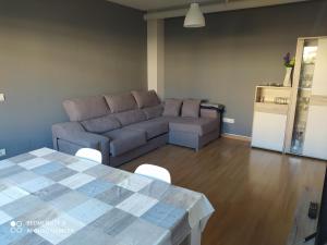 a living room with a couch and a table at Casa Vainilla in San Miguel del Pino +48 photos