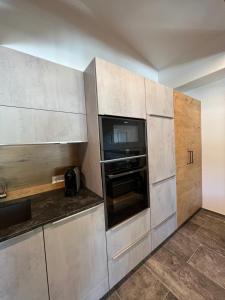 Kuchyň nebo kuchyňský kout v ubytování Inn-Apartments