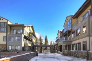 a row of apartment buildings in the snow at Slopeside in Keystone