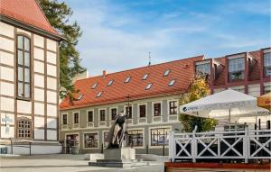 a statue of a woman in front of a building at Beautiful Apartment In Zielona Góra in Zielona Góra