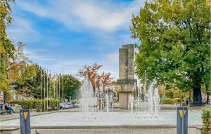 a fountain in the middle of a park at Beautiful Apartment In Zielona Góra in Zielona Góra +13 photos