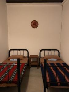 Postel nebo postele na pokoji v ubytování Batu Bata Guesthouse