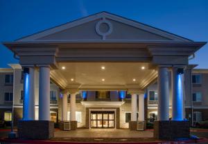 a front view of a building with columns at Holiday Inn Express Hotel & Suites Oklahoma City-Bethany, an IHG Hotel in Bethany