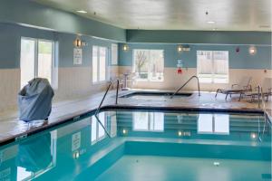 a swimming pool in a building with the water in it at Holiday Inn Express Hotel & Suites Oklahoma City-Bethany, an IHG Hotel in Bethany
