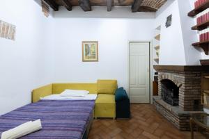 A bed or beds in a room at De'Gombruti, Bologna by Short Holidays