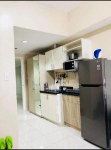 Kuchyň nebo kuchyňský kout v ubytování Bay View Apartment Sunvida Tower 29 SM City