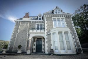 a large brick building with a front door at Victorian Penthouse with panoramic sea views in Ilfracombe