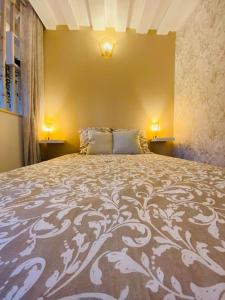 Un pat sau paturi într-o cameră la Brume d'Automne