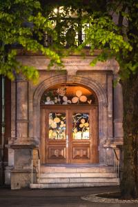 a wooden door with a window on a building at Bergen Børs Hotel in Bergen