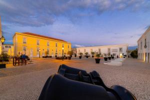 a group of buildings in a town with a street at Pestana Cidadela Cascais - Pousada & Art District in Cascais