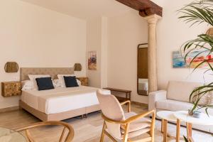 Posteľ alebo postele v izbe v ubytovaní Puerta Catedral Apartments