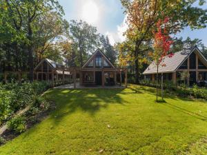 a home with a large yard with a house at Holiday Home in Lochem with Garden View in Lochem