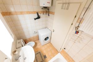 a small bathroom with a toilet and a shower at Muses old town ioannina Urania in Ioannina +29 photos