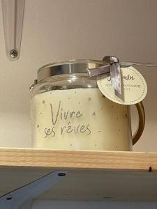 a jar on a shelf with a label on it at Maison de Ville Lumineuse centre ville à pieds - Lit 160 in Quimper