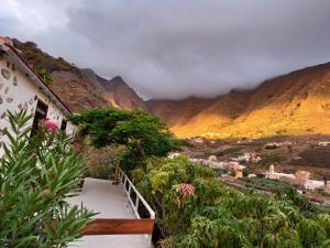 a stairway leading up to a house with a view of a mountain at Casa Panama in Hermigua +17 photos