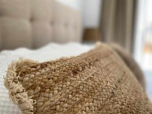 Łóżko lub łóżka w pokoju w obiekcie Apartamentos Casa Macías