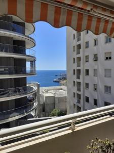 a view of the ocean from the balcony of a building at Vue mer aux portes de Monaco in Beausoleil