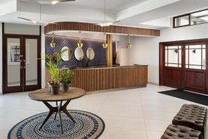 a lobby with a table and a counter at Premier Resort Cutty Sark in Scottburgh