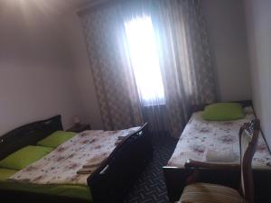 Postel nebo postele na pokoji v ubytování Garni Guesthouse