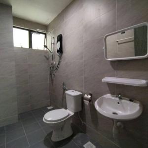 a bathroom with a toilet and a sink at 191 Cozy Casa Kayangan 3BR 6pax by Grab A Stay in Ipoh