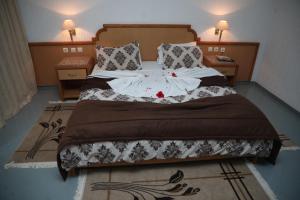 Postel nebo postele na pokoji v ubytování Hotel Royal Jinene Sousse