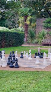 a giant chess set on a sidewalk in a park at Kensington flat with roof terrace and sunshine in London