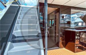 an open staircase on a yacht with a glass door at Awesome Ship In Neuruppin With Kitchen in Neuruppin