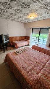 En eller flere senge i et værelse på Hotel Correa Playa