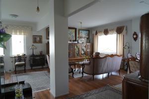 a living room with a couch and a table at Brahenkatu Apartment in Kajaani