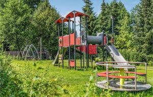 a playground with a slide in a park at Nice Apartment In Nidzica With Wifi in Nidzica