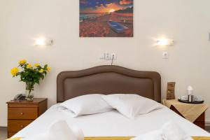 Postel nebo postele na pokoji v ubytování Hotel Alkyon